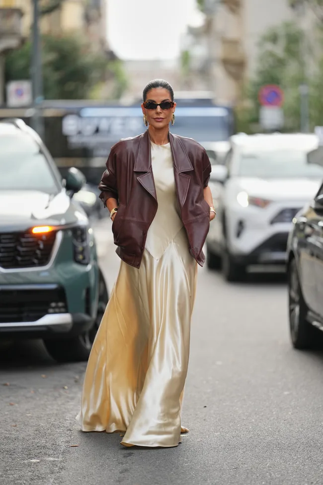 Milan Fashion Week guest wears hair pulled back into a sleek low ponytail