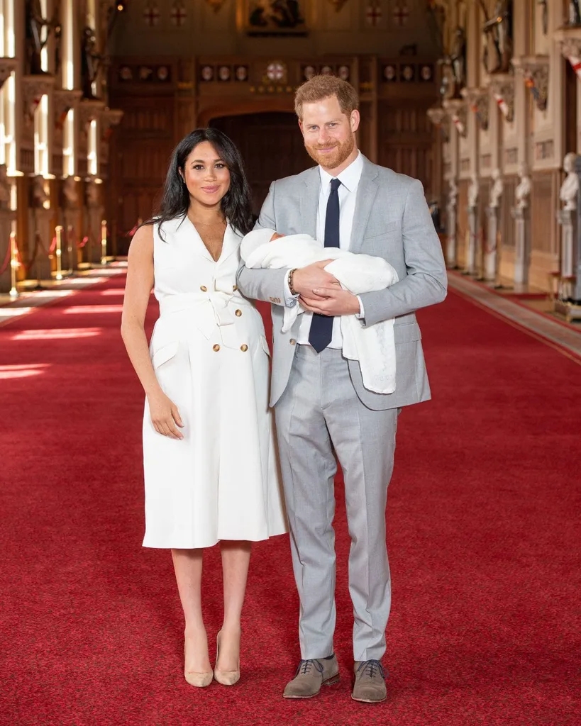meghan and harry pose for an official portrait with their newborn son, prince archie