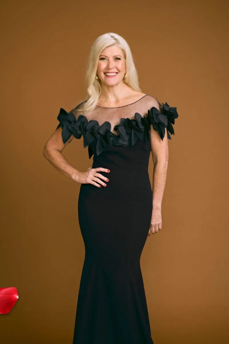 A still of contestant Angela in a black, sheer gown via 'The Golden Bachelor Australia'.