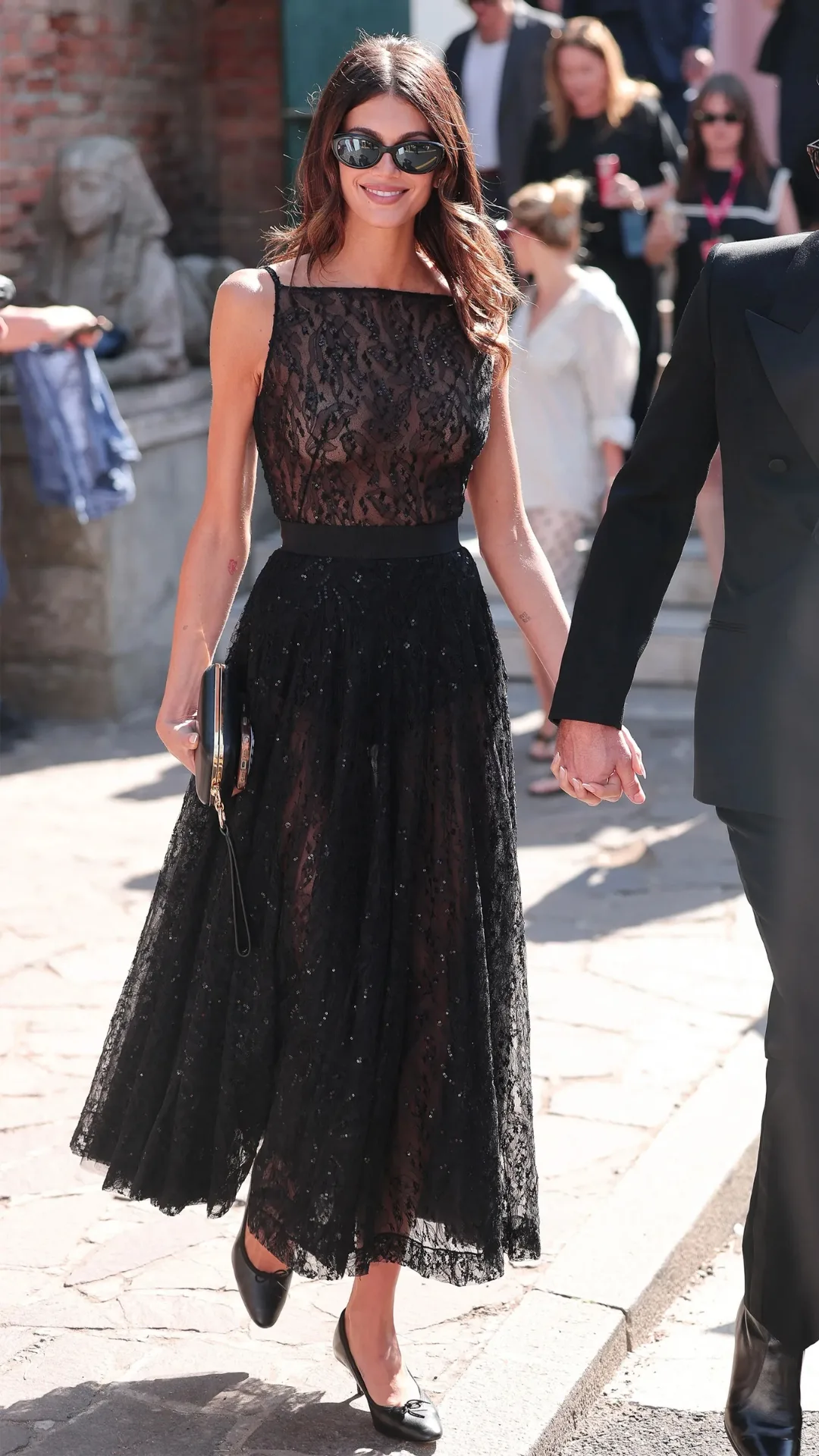 Pictured on the Lido with boyfriend Lewis Pullman, Kaia Gerber stuns in Givenchy dress. 