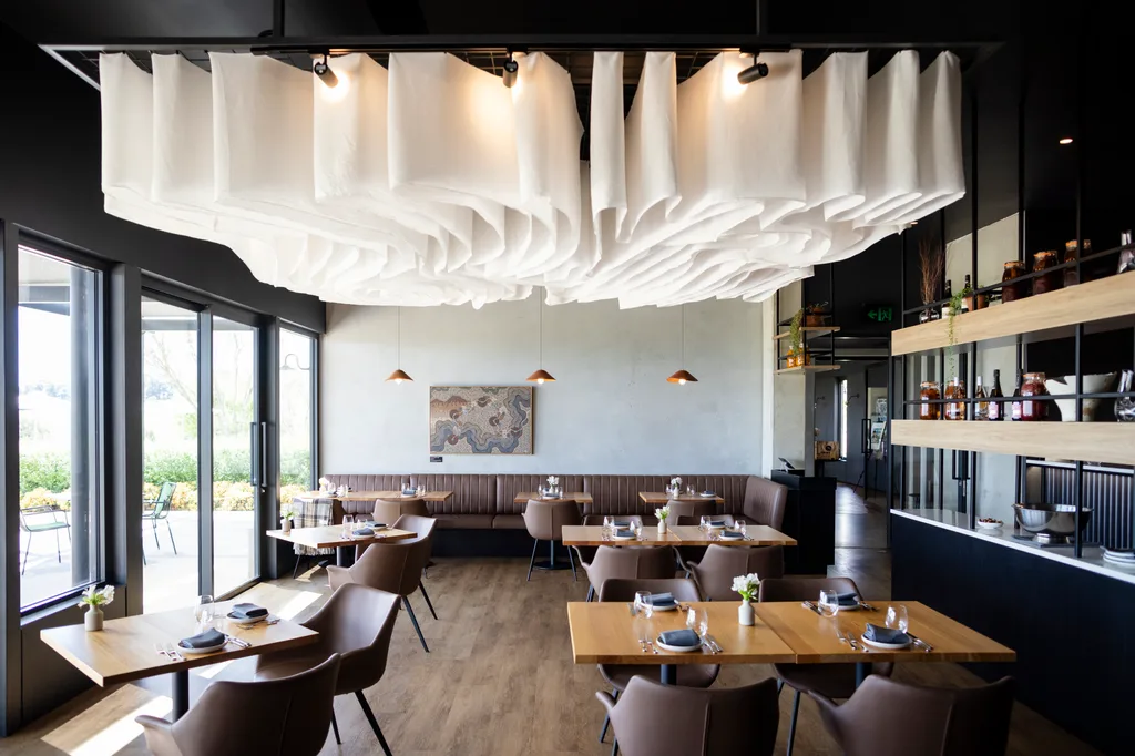 Inside Printhie Dining: a light-filled space of timber, glass, and contemporary design that feels equal parts polished and welcoming.