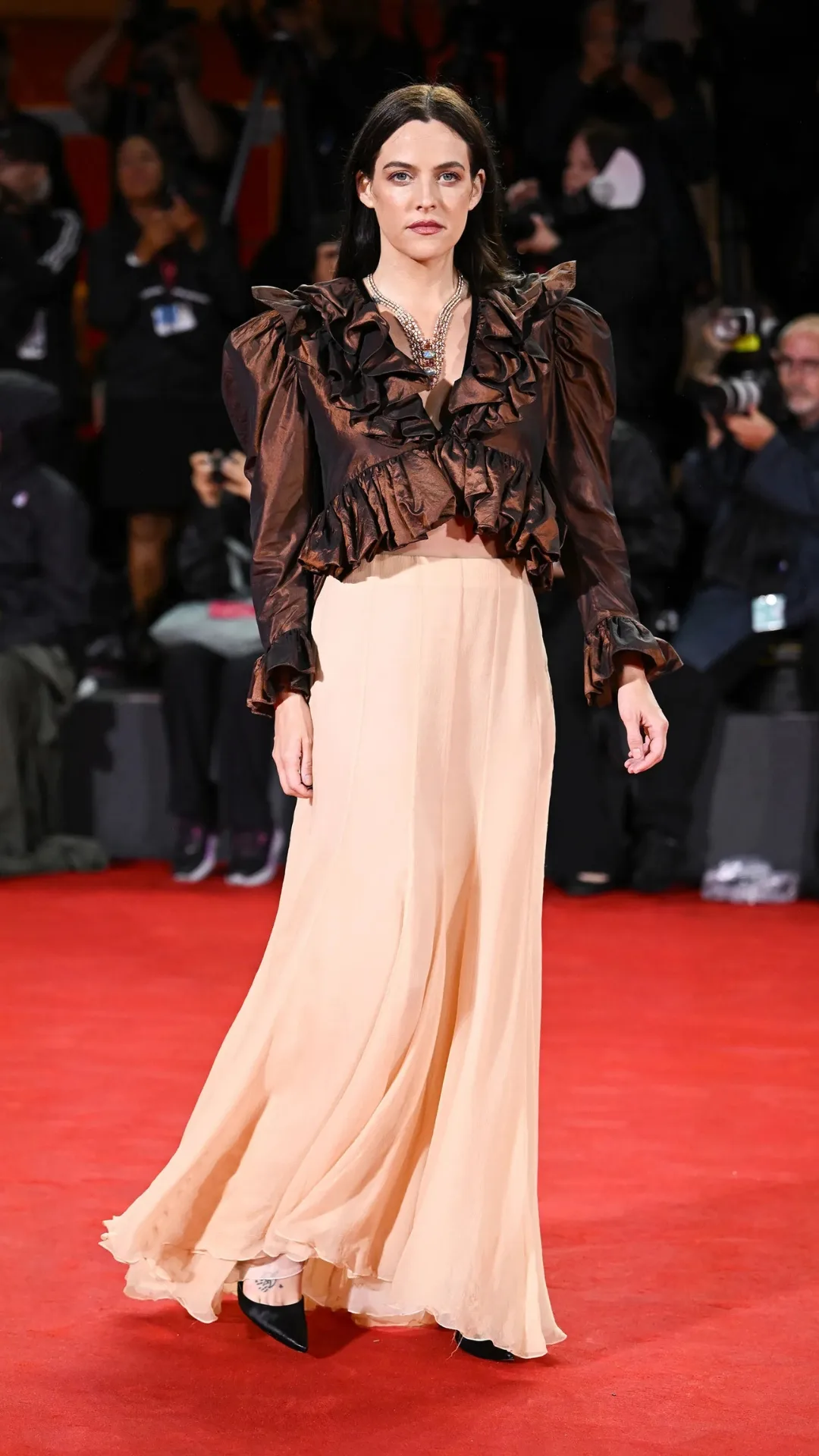Riley Keough pictured in romantic ruffle set with Cartier jewels at the 2025 Venice Film Festival. 