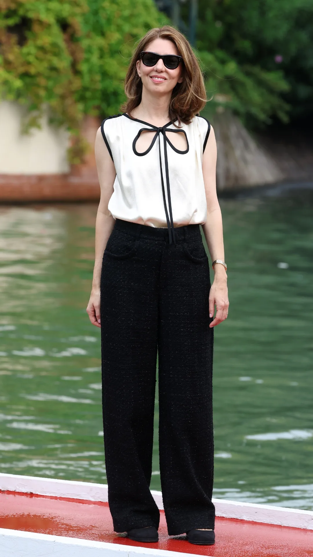 Sofia Coppola pictured walking the Lido in Chanel separates. 