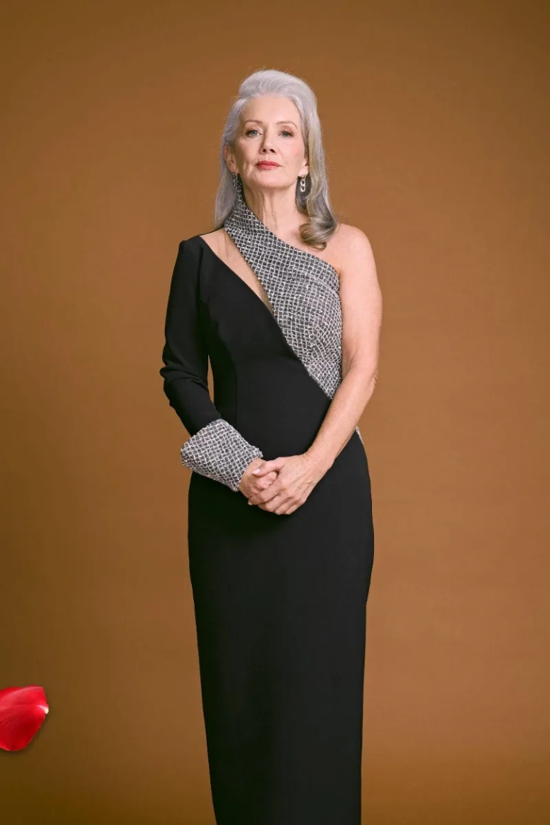 A still of contestant Terri in a black and silver gown via 'The Golden Bachelor Australia'.