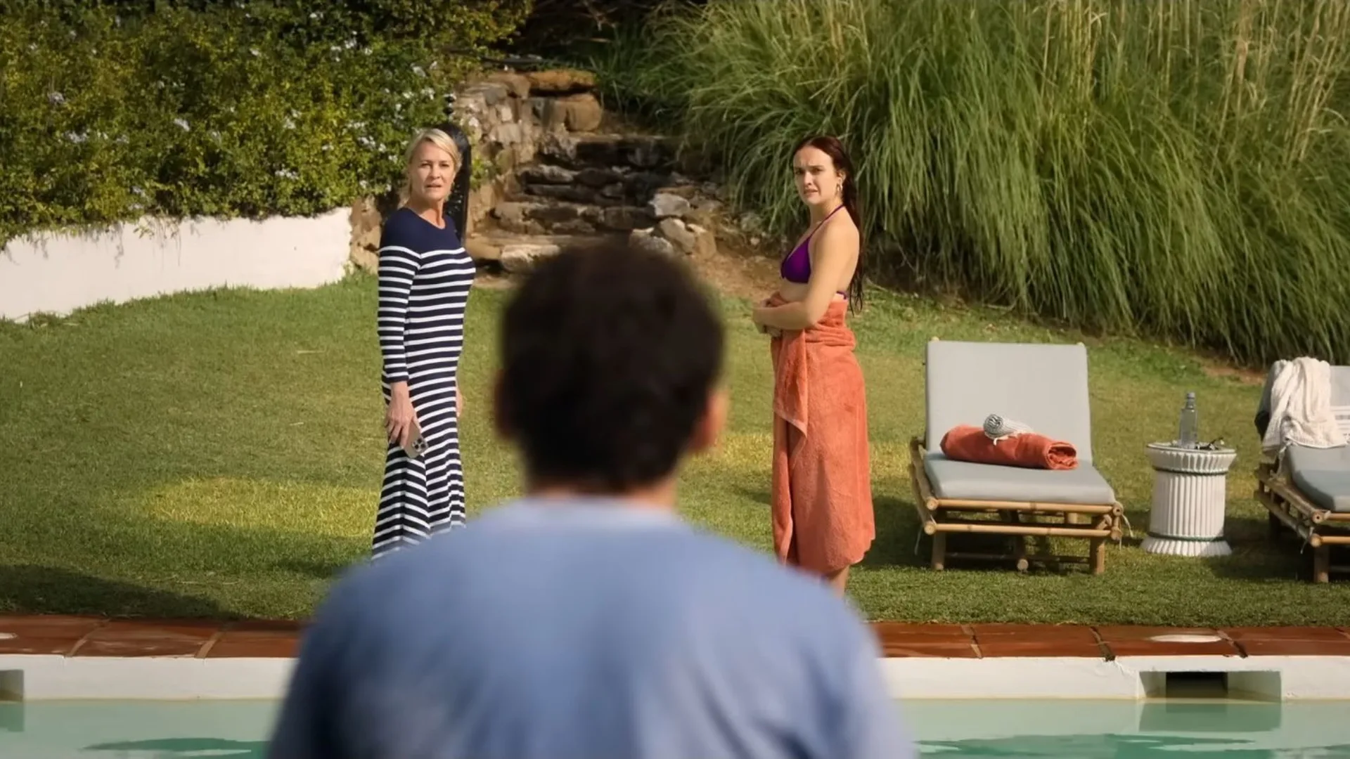 A still from the finale of The Girlfriend featuring all three characters poolside.