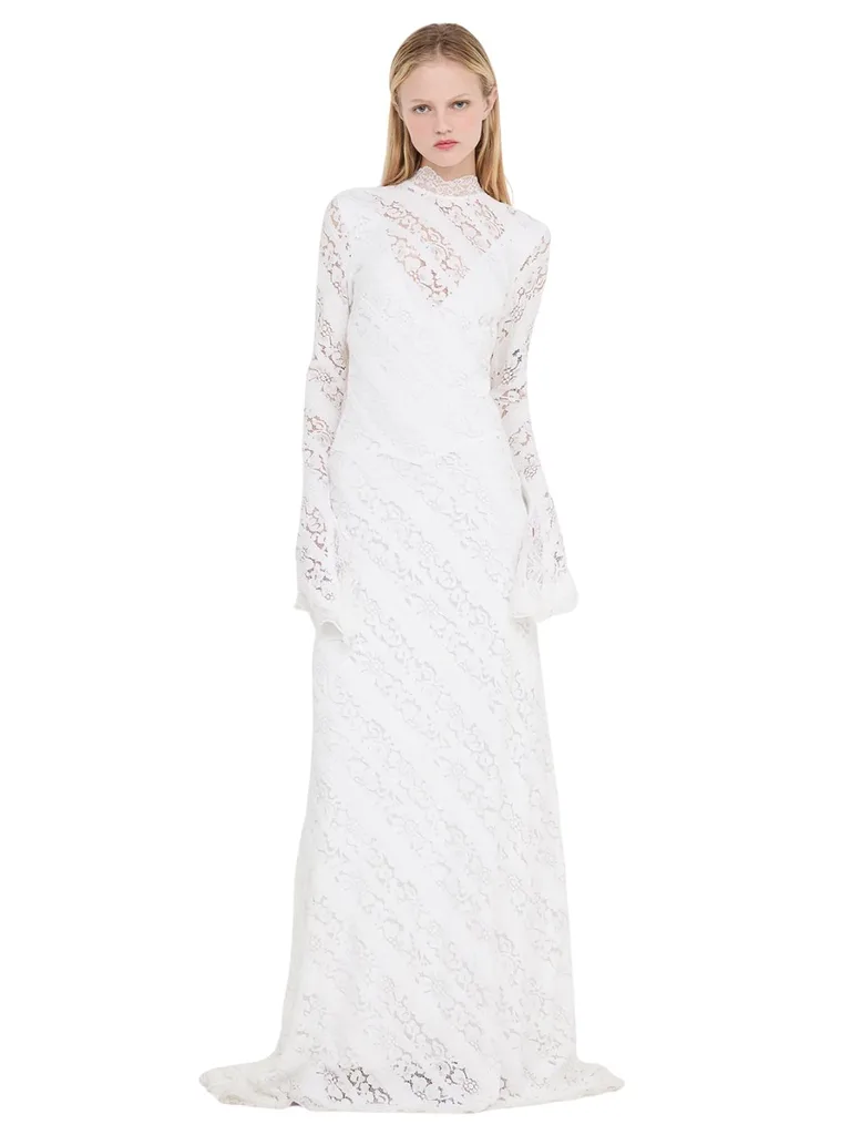 model wears lace white dress