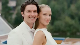 Abby champion and Patrick Schwarzenegger smile to camera