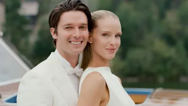 Abby champion and Patrick Schwarzenegger smile to camera