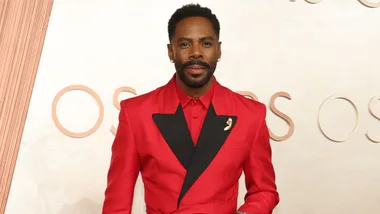 Colman Domingo in a red blazer at the Oscars