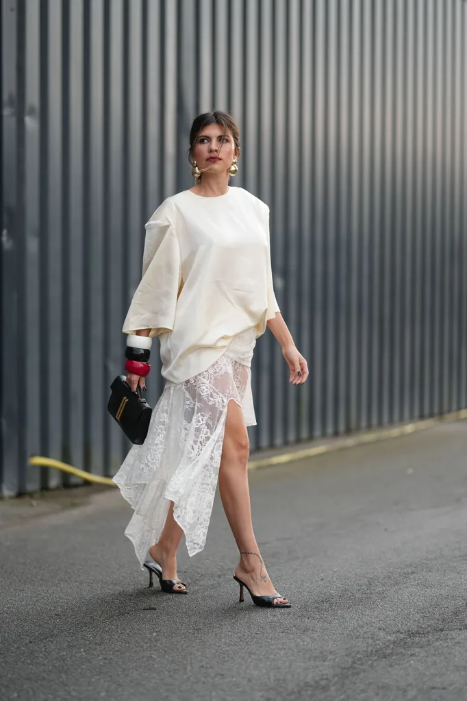 girl wears sheer lace skirt with oversized shirt
