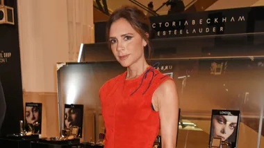 Victoria Beckham wears a red dress