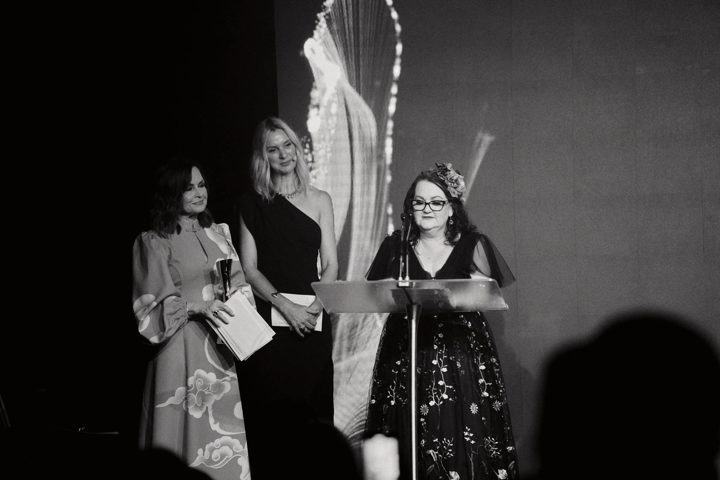 Emma Mason wins marie claire's 2025 Changemaker of the Year award. On stage with marie claire editor Georgie McCourt and media icon Lisa Wilkinson.