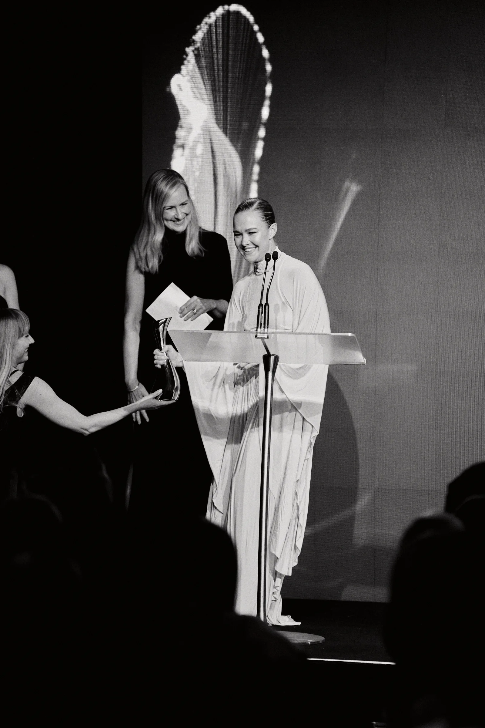 Journalist Melissa Doyle presents marie claire's 2025 Icon of the Year award to Rose Byrne, accepted by friend Krew Boylan. 