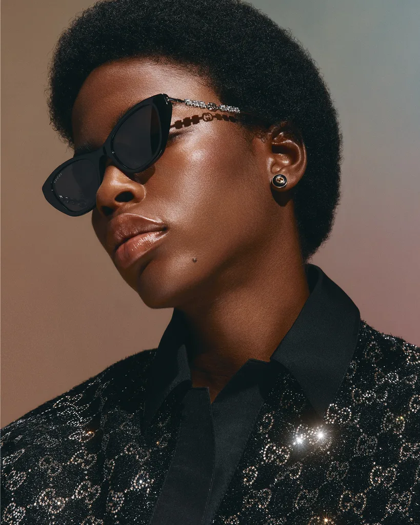 Gucci sunglasses,
$895, top, $5400,
and earrings, $3350.