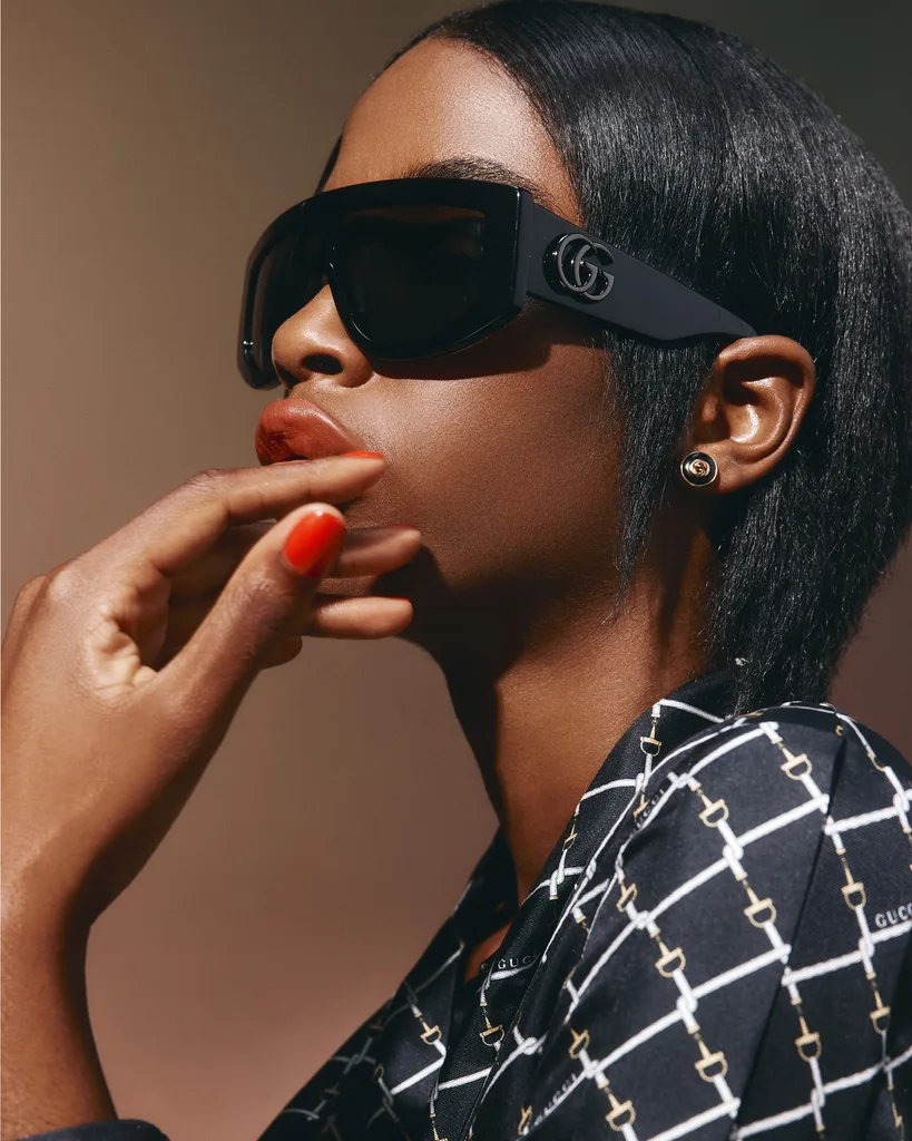 Gucci sunglasses, $790, dress, $5600, and earrings, $3350.