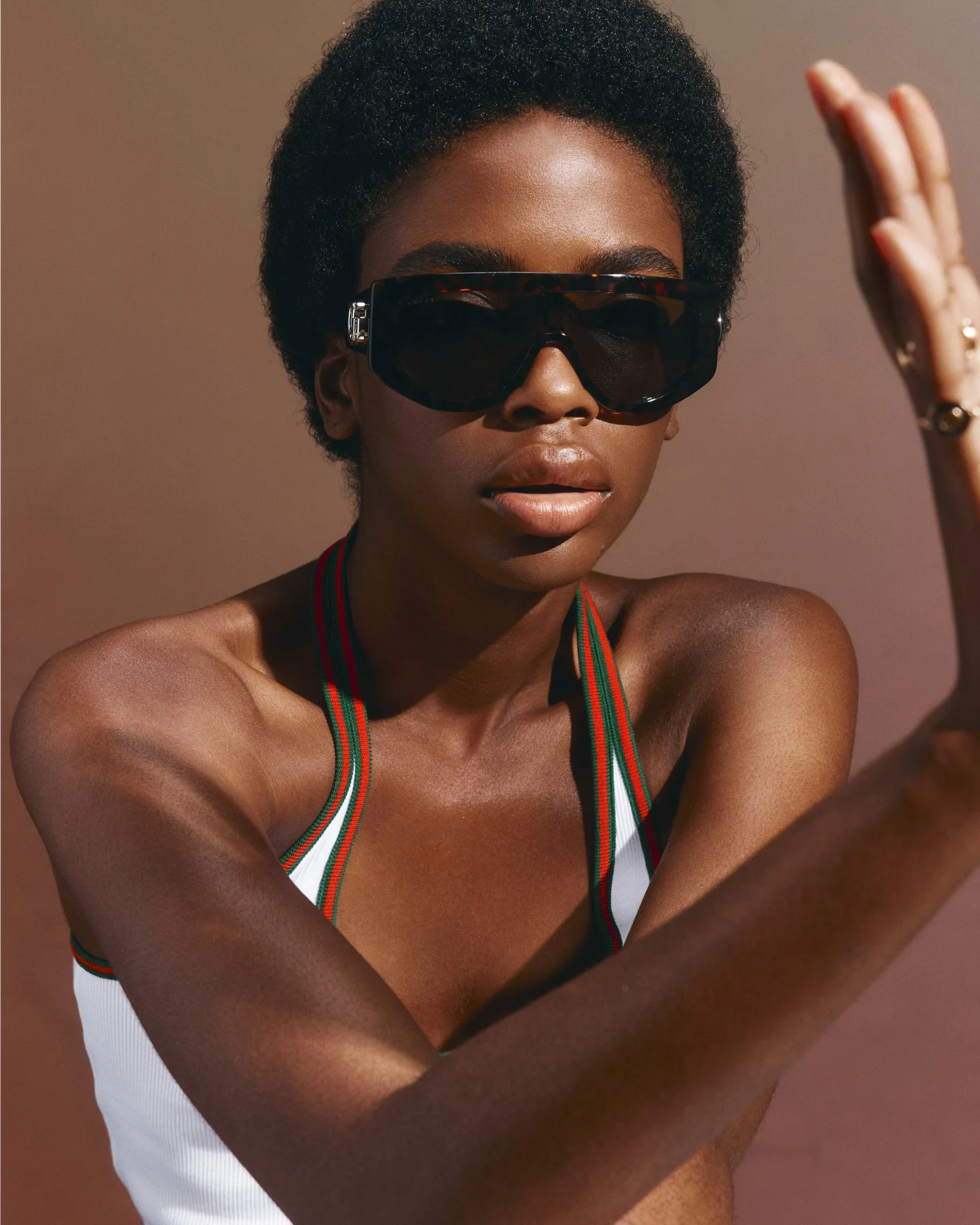 Gucci sunglasses,
$790, top, $1000,
and rings (from top),
$5200, $1800, $3400.