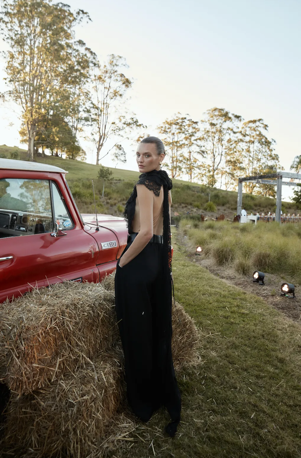Montana Cox wears a bodysuit, pants and belt from Ralph Lauren Collection. 