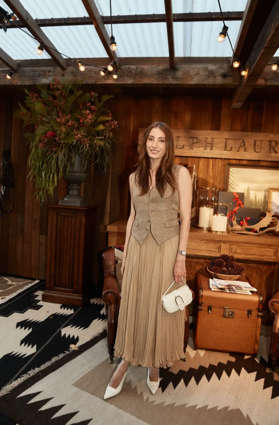 Rebecca Harding wears a vest and skirt from Ralph Lauren Collection. 