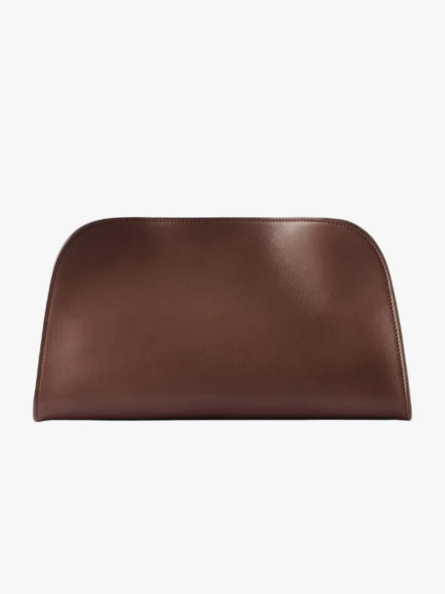 Best Day To Night Convertible Handbags For Your Capsule Wardrobe_The Row Peggy Leather Clutch_marie claire