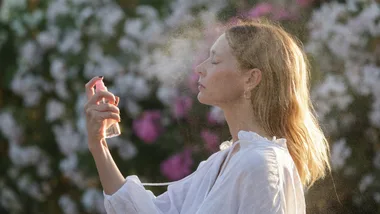 woman spraying face