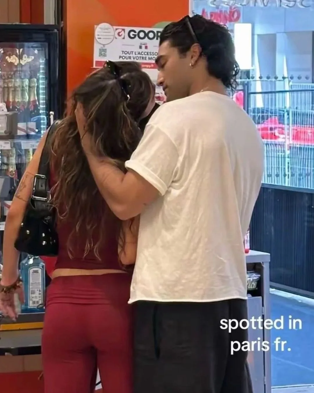 Josh Heuston cradling Mika Abdalla's head at a convenience store in Paris.