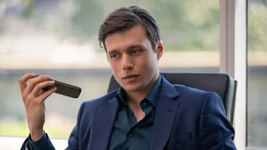 Nick Robinson wearing a suit in Voicemails for Isabelle