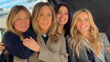 group of celebrity women hugging