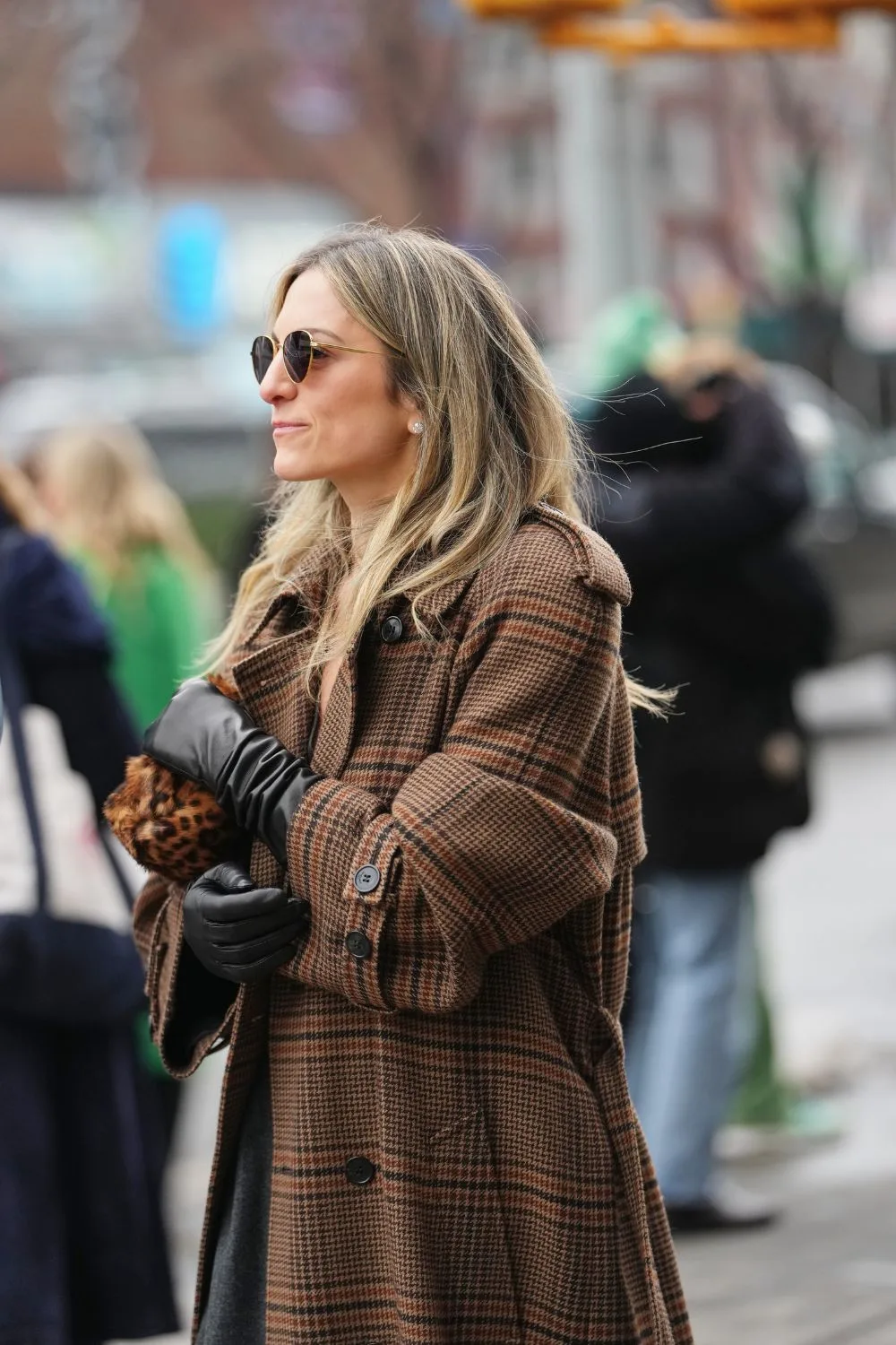 Woman in brown coat and gloves street style