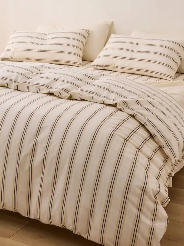 Jude Cotton bed cover and sheets in a cream and chocolate brown stripe from the Sheet Society