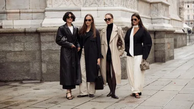4 women in a group- street style in Europe wearing monochromatic fashion
