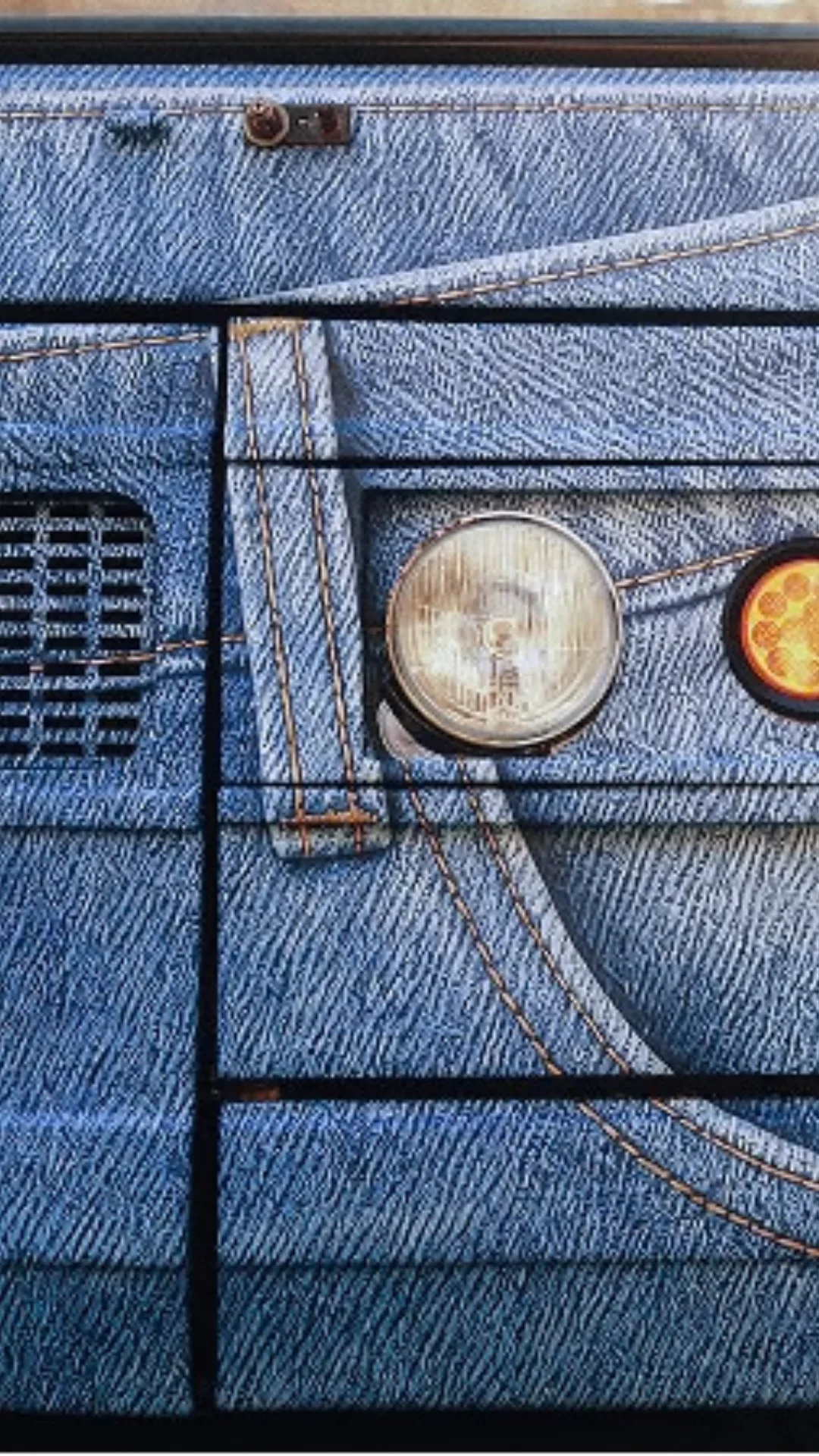 The front of a bus covered in denim print.