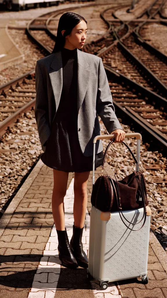 Louis Vuitton woman with suitcase