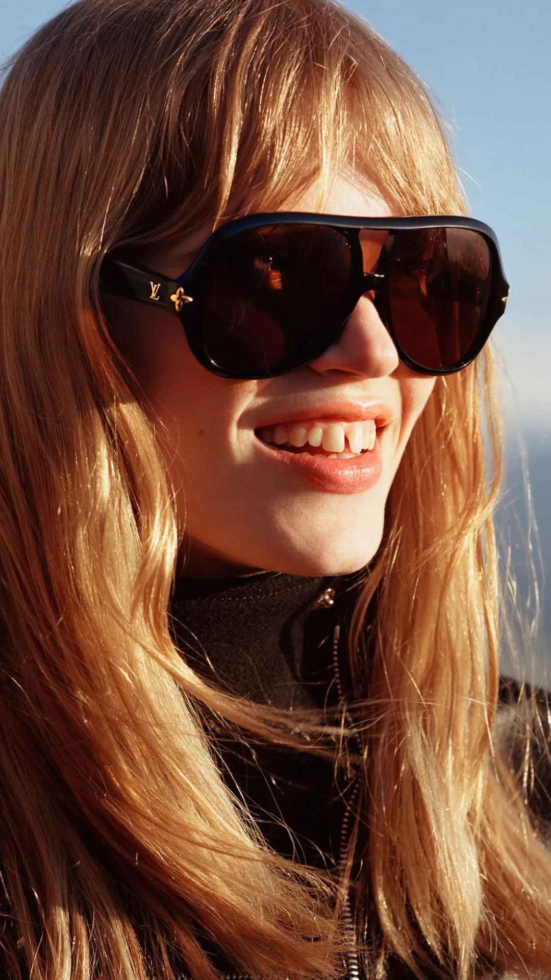 Woman wearing sunglasses for Louis Vuitton