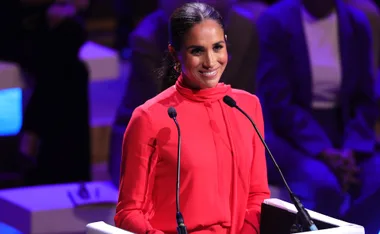 Meghan Markle Just Wore A Dramatic Siren-Red Monochrome Pantsuit