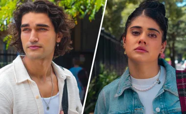 Two characters from Netflix's Rebelde; one with curly hair and a necklace, the other with dark hair and a denim jacket.