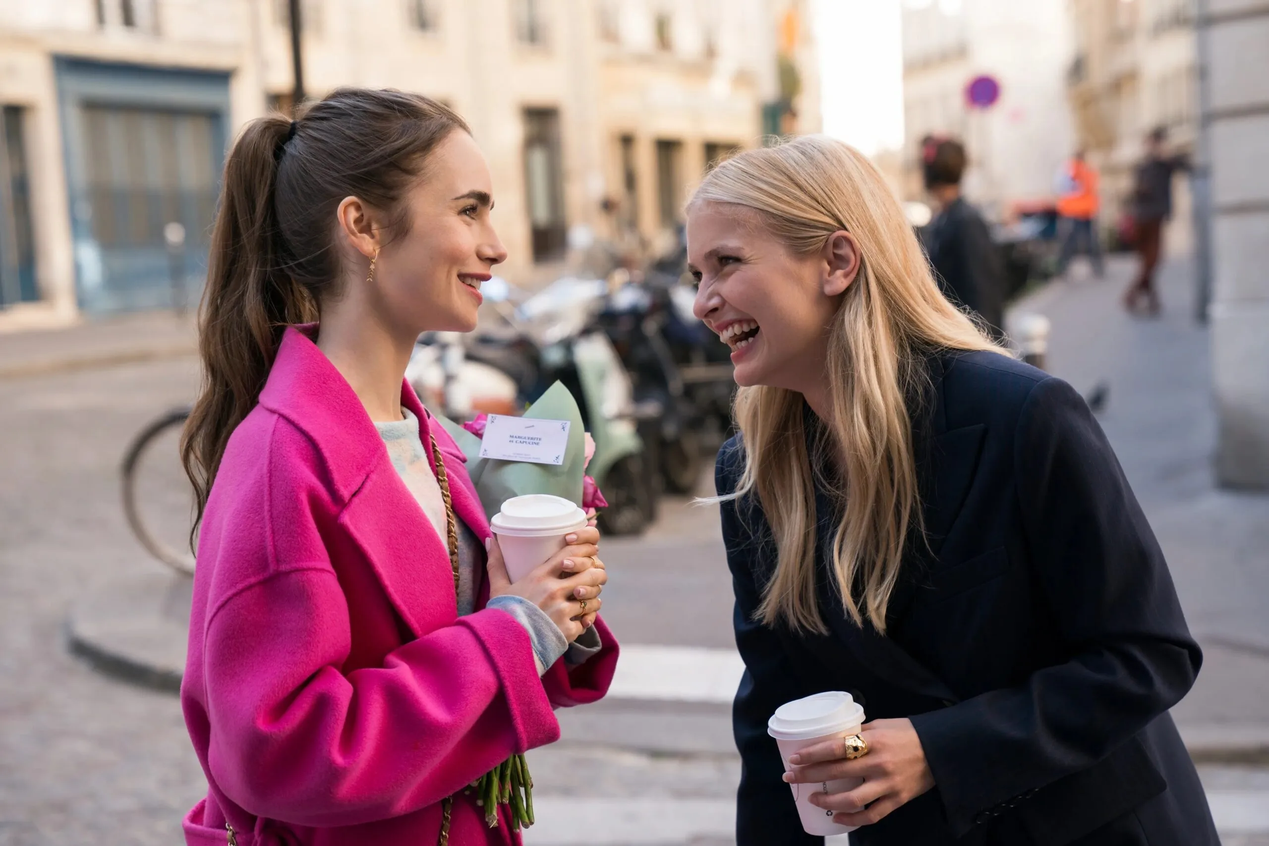 Camille Razat and Lily Collins in 'Emily in Paris'.