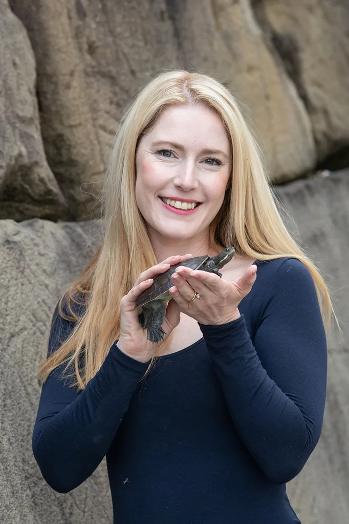 woman holding turtle