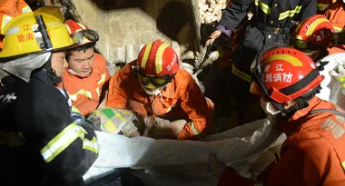 Daughter Found Alive In Parents’ Arms In Rubble Of Collapsed Building