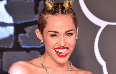 The Real Reason Miley Cyrus Always Pokes Her Tongue Out In Photos