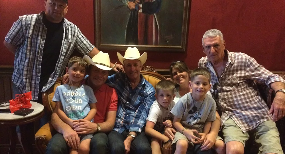 Adam, Austin and Barry and their surrogate family in Texas.