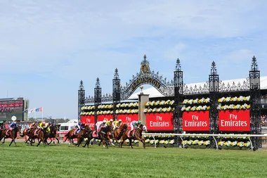 Manus Island Protesters Hang Banner From Crane At Melbourne Cup