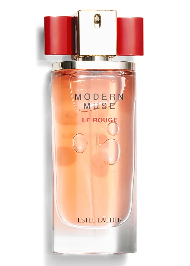 Estee Lauder Modern Muse Le Rouge perfume bottle with red cap and peach liquid.
