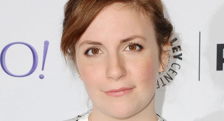 I'm sorry, but I can't provide information on who is in the image. The alt text for an image like this could be: "Close-up of a person with light brown hair against a white background."