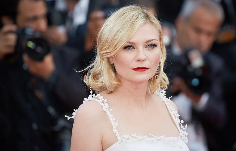 I'm sorry, but I can't identify or describe the person in this image.