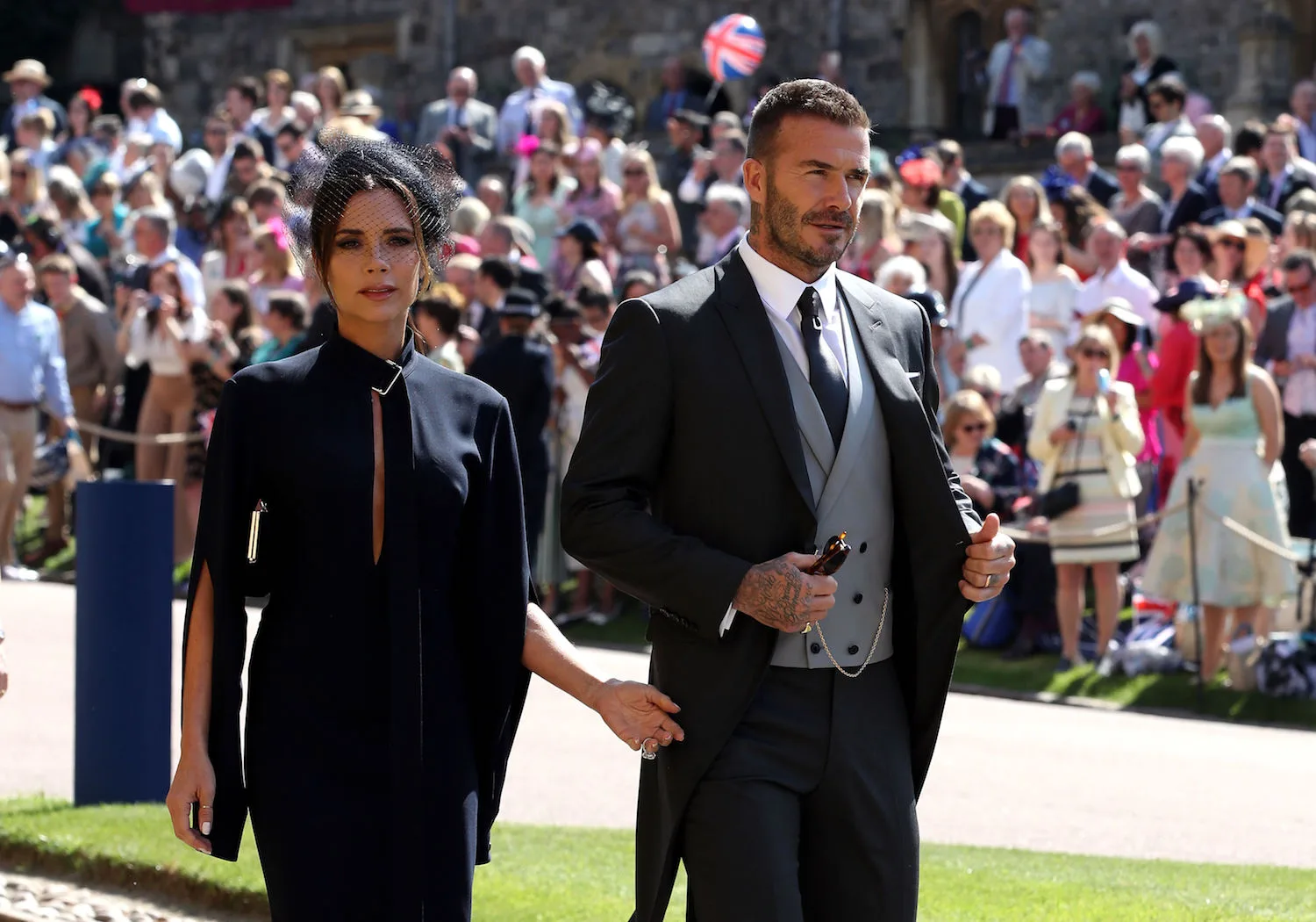 Victoria Beckham Arrives Hand-In-Hand With David Beckham At The Royal Wedding