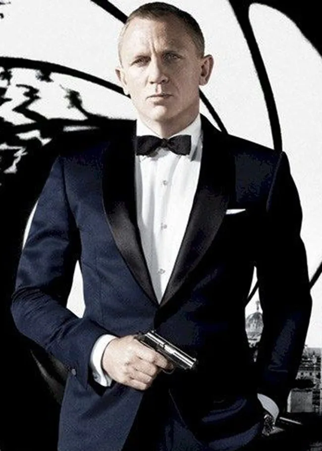 A man in a tuxedo holding a gun, with a stylized background often associated with spy genres.