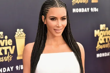 Kim Kardashian Causes A Stir With Controversial Hair-Do On Red Carpet