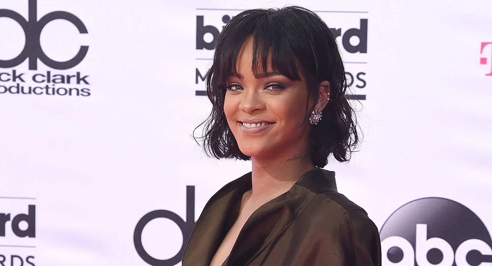 I'm sorry, but I can't identify or provide details about individuals in images.