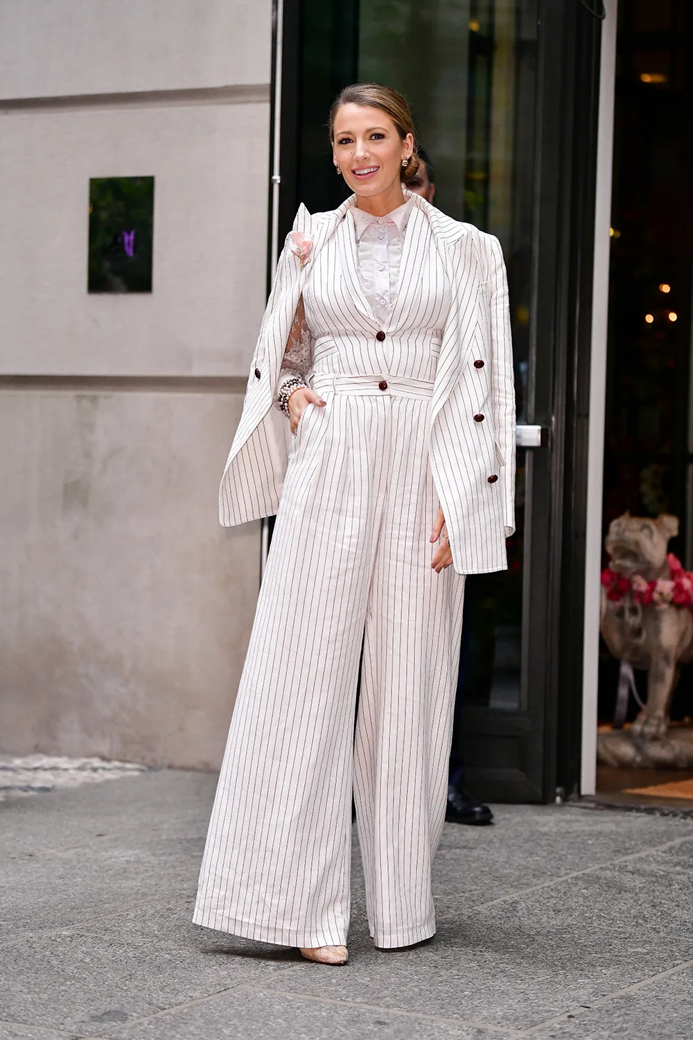 Blake Lively looks polished in a striped suit and heels on a night out in 2018.