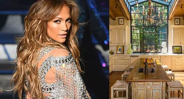 Fashionable woman in a dazzling outfit next to a stylish kitchen with rustic decor and large window.